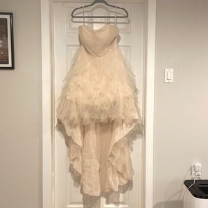 Blush colored strapless gown with satin ribbon that laces up the back